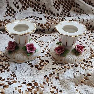 Elegant White and Gold Candle Holders with Pink Accents